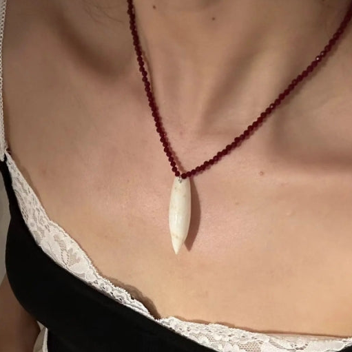 Handcrafted conch pendant with deep red beads necklace,natural conch shells, featuring a simple and exquisite design. It's a perfect gift.