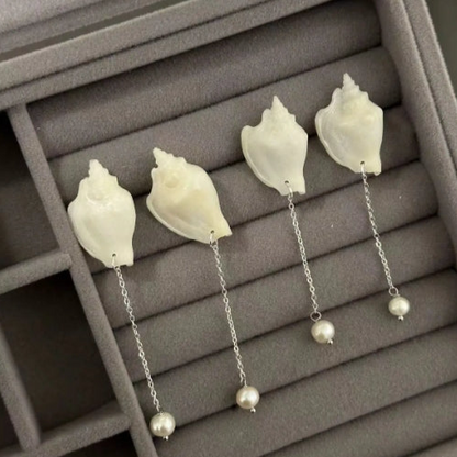 Handcrafted from natural white conch shells, accented with pearls,s925 silver posts, showcasing a unique and minimalist design,perfect gift