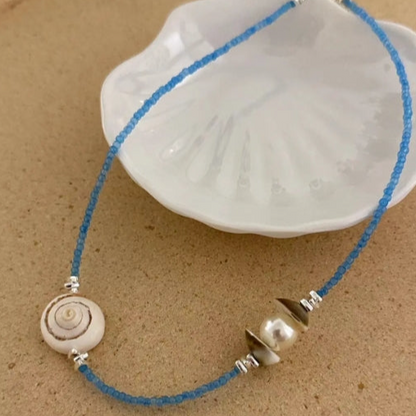 Handcrafted natural shell necklace, paired with a blue beaded strand, designed with a simple and elegant aesthetic,a thoughtful gift for her